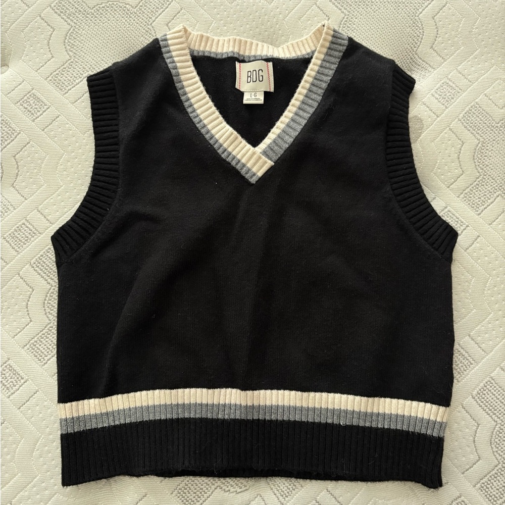 black, white, and gray knit sweater vest